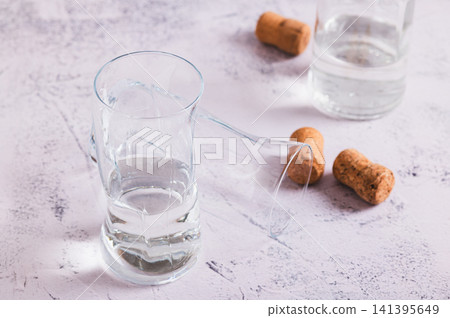 Staying sober in dry January, glasses and a bottle on the table Staying sober in dry January, glasses and a bottle on the table 141395649