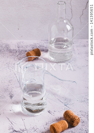 Staying sober in dry January, glasses and a bottle on the table vertical view Staying sober in dry January, glasses and a bottle on the table vertical view 141395651