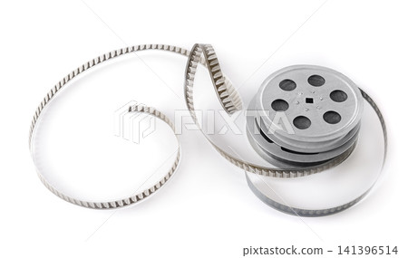 Vintage Metal Movie Reel with Unrolled Analog Film Strip Isolated on White Background. Classic Cinematography Equipment for Retro Cinema Production with Copy Space. Vintage Metal Movie Reel with Unrolled Analog Film Strip Isolated on White Background. Classic Cinematography Equipment for Retro Cinema Production with Copy Space. 141396514
