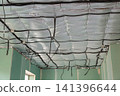 Electrical cable installation above insulated ceiling during house construction 141396644