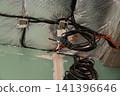 House renovation showing ceiling wiring and insulated roof structure 141396646