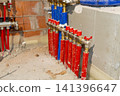 Copper plumbing pipes with thermal insulation inside brick wall 141396647