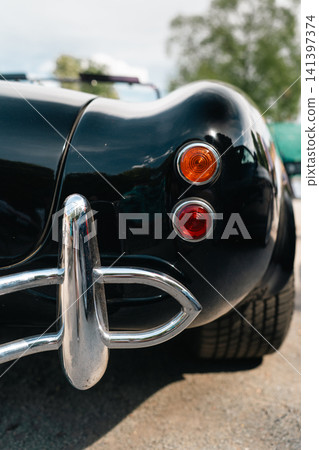Rear Lights and Chrome Bumper of Classic AC Cobra Style Roadster Rear Lights and Chrome Bumper of Classic AC Cobra Style Roadster 141397374