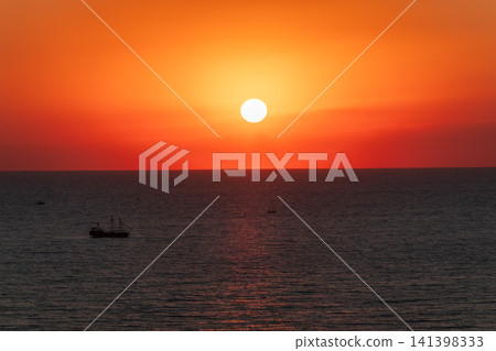 Beautiful red and orange sunrise over the sea. Beautiful red and orange sunrise over the sea. 141398333