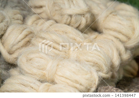 Traditional sheep wool processing, rural crafts, shepherd's heritage, hand-made wool processing and authentic Traditional sheep wool processing, rural crafts, shepherd's heritage, hand-made wool processing and authentic 141398447