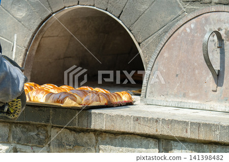 The pies are baked in the oven. The pies are baked in the oven. 141398482