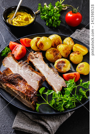 American Backyard Grilled Pork Ribs with potatoes American Backyard Grilled Pork Ribs with potatoes 141398528