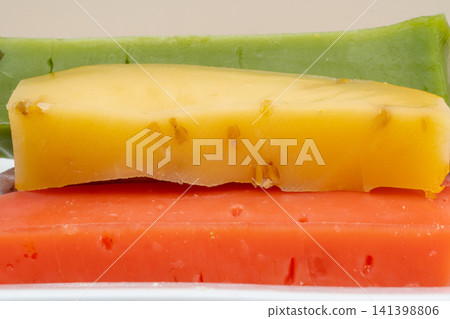 different types of gouda: plain yellow cheese and green cheese with pesto, spices and nuts. Cheese plate 141398806