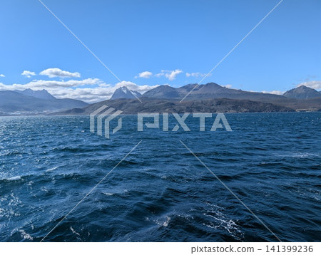Ushuaia, Argentina - March 6, 2026: Rugged Mountains Beyond the Windy Beagle Channel 141399236