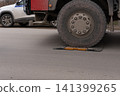Large truck wheel on portable weighing scales for axle load control 141399265
