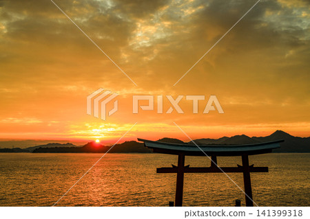 Sunrise over the Seto Inland Sea, Hiroshima Prefecture, with sea fog drifting across it. Sunrise over the Seto Inland Sea, Hiroshima Prefecture, with sea fog drifting across it. 141399318