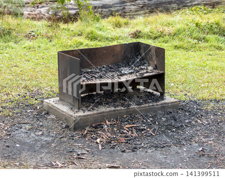 A fire pit and barbeque in a remote campground in the Blue Mountains A fire pit and barbeque in a remote campground in the Blue Mountains 141399511