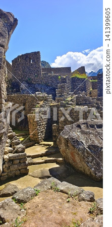 Ancient stone architecture and narrow passageways in the ruins of Machu Picchu, Peru. Ancient stone architecture and narrow passageways in the ruins of Machu Picchu, Peru. 141399605