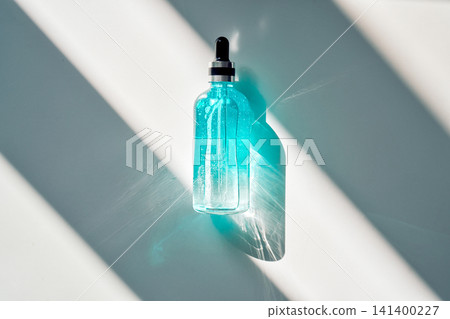 Skincare serum dropper bottle in sunlight Skincare serum dropper bottle in sunlight 141400227