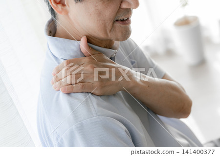 Image of a man with a shoulder ache Image of a man with a shoulder ache 141400377