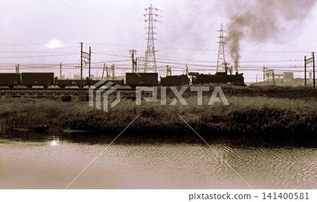 1970 Steam locomotive D51 hauling freight train, Tsurumi River, Takashima freight line, Yokohama, Kanagawa Prefecture, archive photo 1970 Steam locomotive D51 hauling freight train, Tsurumi River, Takashima freight line, Yokohama, Kanagawa Prefecture, archive photo 141400581
