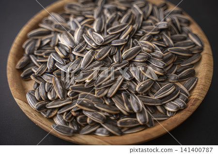 Sunflower seeds are a delicious snack. Sunflower seeds are a delicious snack. 141400787