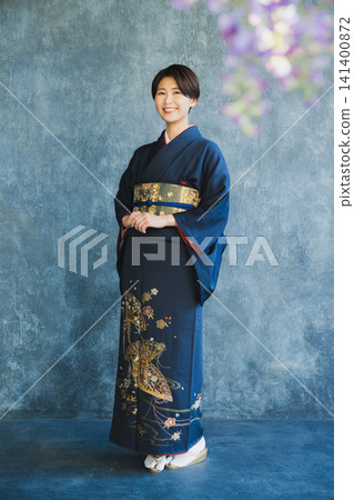 Woman wearing a tsukesage, Japanese clothing, kimono, visiting kimono Woman wearing a tsukesage, Japanese clothing, kimono, visiting kimono 141400872