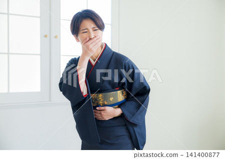 Woman wearing a tsukesage, Japanese clothing, kimono, visiting kimono Woman wearing a tsukesage, Japanese clothing, kimono, visiting kimono 141400877