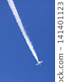 The Blue Impulse aerobatic team flies, drawing white smoke trails across the blue sky. 141401123