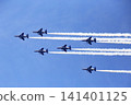 The Blue Impulse aerobatic team flies in formation across a beautiful blue sky. 141401125