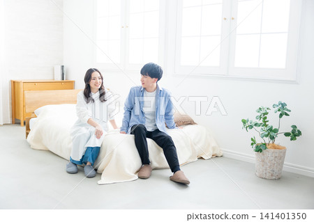 A couple to relax in the bedroom 141401350