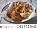 Fried food on a plate: Fried chicken and croquettes 141401948