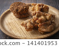 Fried food on a plate: Fried chicken and croquettes 141401953