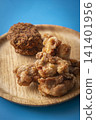 Fried food on a plate: Fried chicken and croquettes 141401956