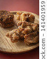 Fried food on a plate: Fried chicken and croquettes 141401959