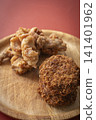 Fried food on a plate: Fried chicken and croquettes 141401962