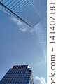 A skyscraper rising in the blue sky 141402181