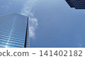 A skyscraper rising in the blue sky 141402182