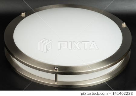 Round ceiling light fixture in a simple design Round ceiling light fixture in a simple design 141402228
