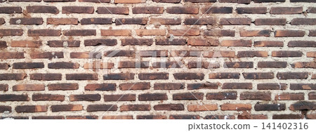 Texture of an old red brick wall with rough mortar joints. Texture of an old red brick wall with rough mortar joints. 141402316