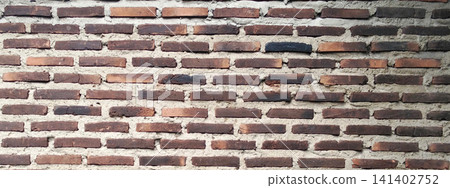 Dark burnt brick wall with exposed concrete mortar texture Dark burnt brick wall with exposed concrete mortar texture 141402752