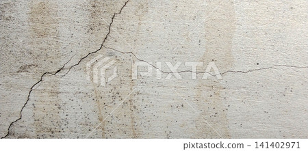 Texture of a weathered concrete wall with cracks and water stains. Texture of a weathered concrete wall with cracks and water stains. 141402971