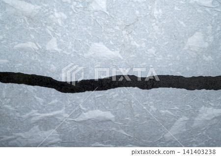 A close-up macro photograph featuring a single, uneven horizontal black glitter strip contrasting against a textured, light gray or silver metallic paper surface, ideal for modern abstract backgrounds A close-up macro photograph featuring a single, uneven horizontal black glitter strip contrasting against a textured, light gray or silver metallic paper surface, ideal for modern abstract backgrounds 141403238