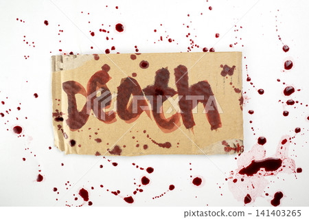 Piece of cardboard with the word 'death' written in blood, surrounded by bloody splatters on a white background. Concept of crime, murder, horror, or violent threat. Horror or Halloween background Piece of cardboard with the word 'death' written in blood, surrounded by bloody splatters on a white background. Concept of crime, murder, horror, or violent threat. Horror or Halloween background 141403265