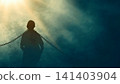Dramatic silhouette of a man bound by chains looking up toward a powerful divine light, symbolizing hope, liberation, salvation, and breaking free from captivity 141403904