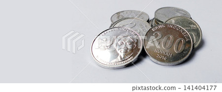 Close-up photo of a stack of Indonesian Rupiah coins with copy space. Close-up photo of a stack of Indonesian Rupiah coins with copy space. 141404177