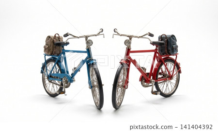 Two miniature decorative bicycle models with backpacks attached bicycles miniature backpacks transportation adventure collectible equipment handlebars background ornament recreation Two miniature decorative bicycle models with backpacks attached bicycles miniature backpacks transportation adventure collectible equipment handlebars background ornament recreation 141404392