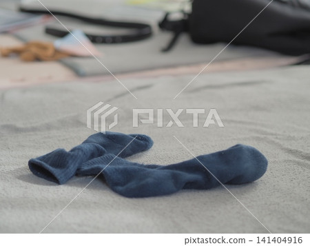 The image of socks scattered around after being taken off The image of socks scattered around after being taken off 141404916