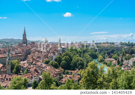 Panoramic view of Bern old town from Rose Garden Rosengarten, capital city of Switzerland. Scenic landscape with Aare River loop and Bern Cathedral Minster tower, famous Europe travel destination Panoramic view of Bern old town from Rose Garden Rosengarten, capital city of Switzerland. Scenic landscape with Aare River loop and Bern Cathedral Minster tower, famous Europe travel destination 141405429