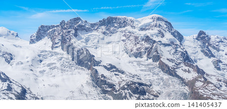Snow Capped Mountains and Glacier near Matterhorn Mountain in Zermatt, Switzerland, Scenic Swiss Alps Landscape under Blue Sky, Famous Swiss Alps Landmark and popular European Travel Destination Snow Capped Mountains and Glacier near Matterhorn Mountain in Zermatt, Switzerland, Scenic Swiss Alps Landscape under Blue Sky, Famous Swiss Alps Landmark and popular European Travel Destination 141405437