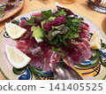 Fresh fish carpaccio with green salad 141405525