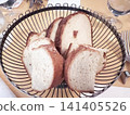Sliced bread served in a basket 141405526