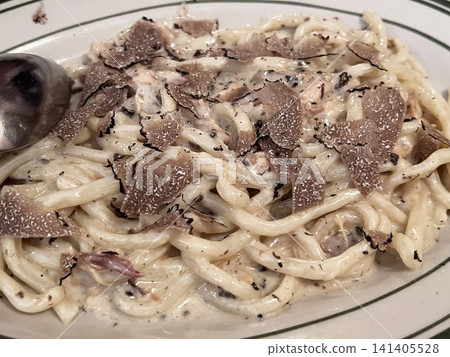 Pasta with rich cream sauce and truffles Pasta with rich cream sauce and truffles 141405528