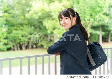 Smiling elementary school, junior high school, and high school girls in a school building Smiling elementary school, junior high school, and high school girls in a school building 141405765