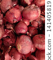Fresh Red Onions Piled Together at Local Market 141405819